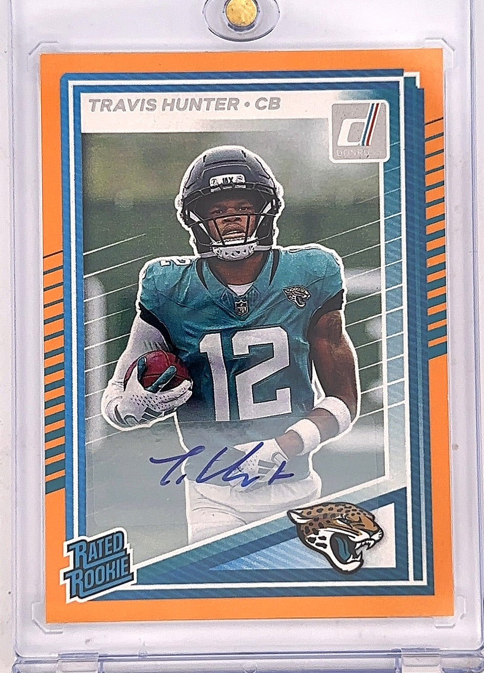 2025 Panini Donruss Travis Hunter [Orange Autograph] #301 — front